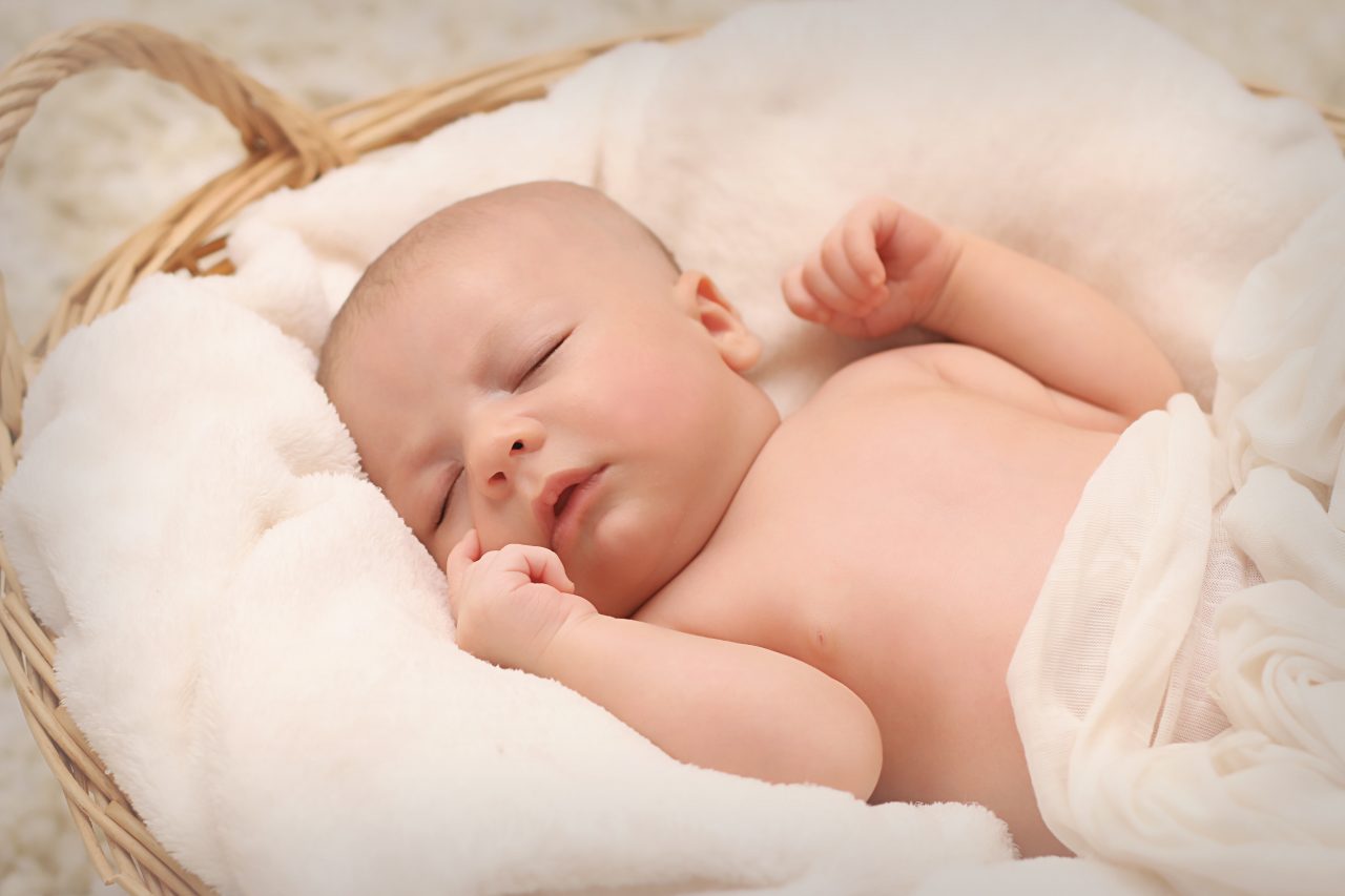 baby sleeping on white cotton 161709