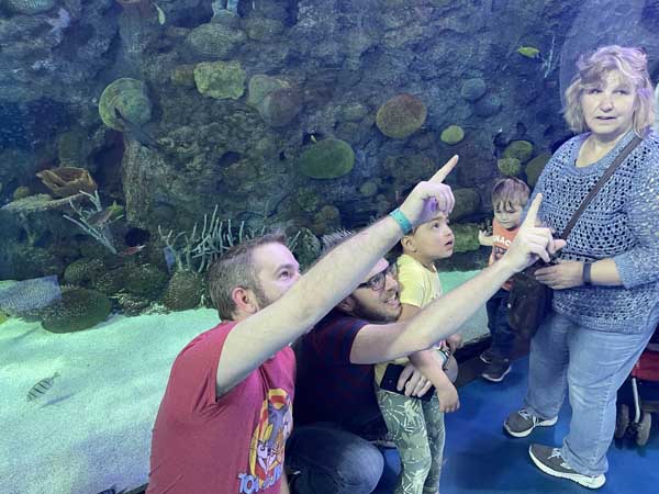 parent and child at aquarium