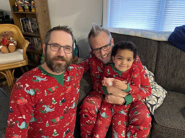 parents and child in pajamas